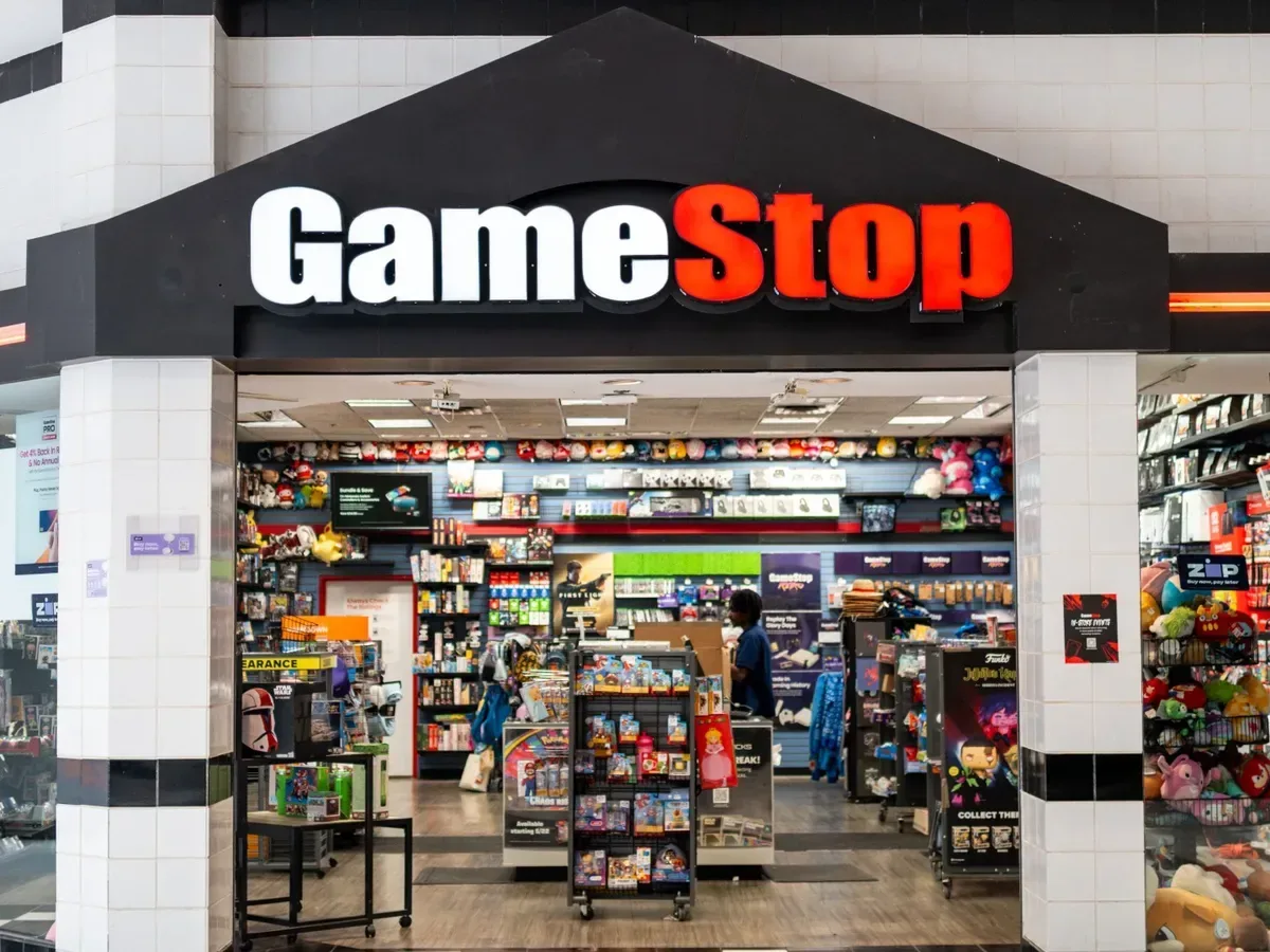 Physical video game cases and collectibles displayed in a game retail store