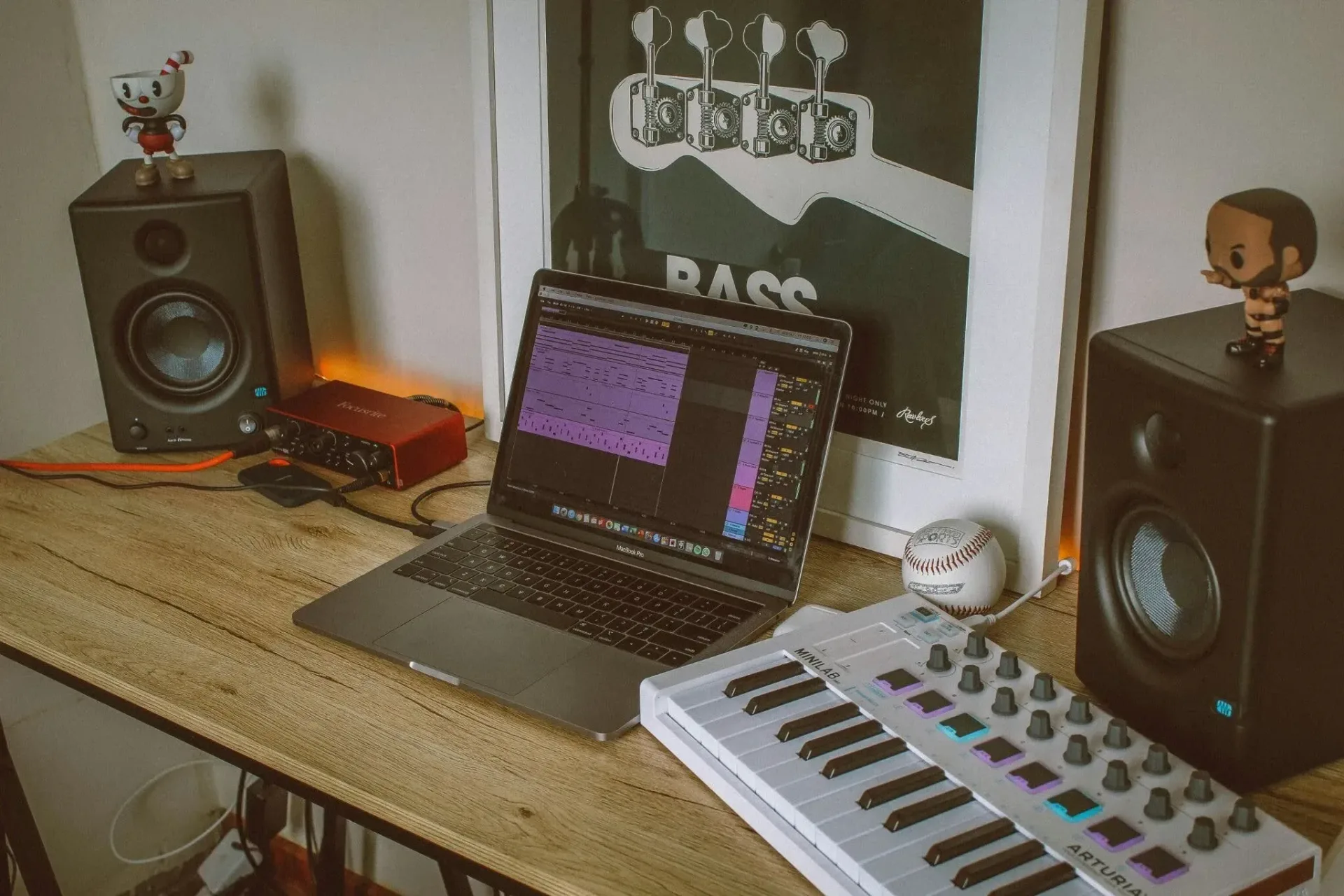 Independent musician preparing a digital music release on a laptop
