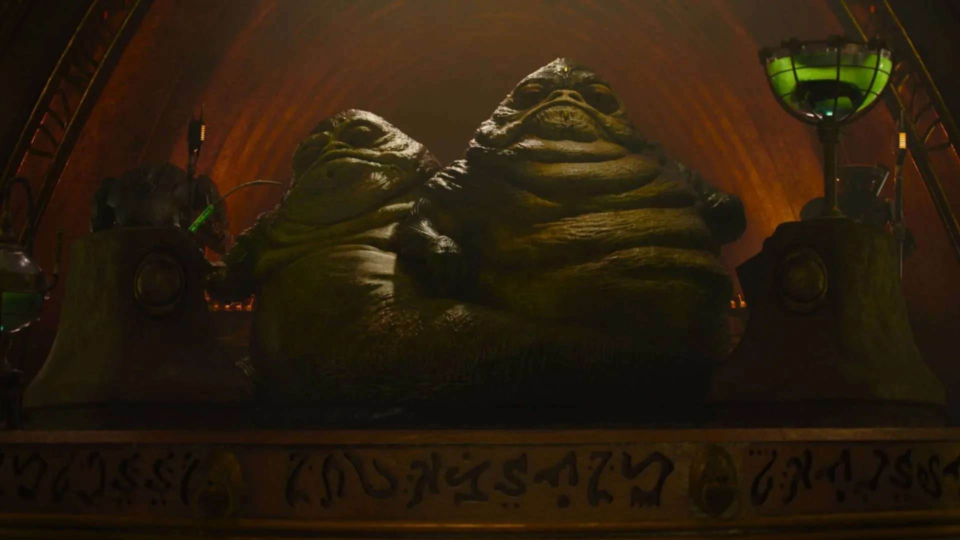 Grogu and Rotta the Hutt playing with a ball on a beach in The Mandalorian and Grogu