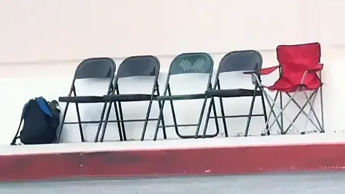 Camping chairs marking places in a trading card release queue