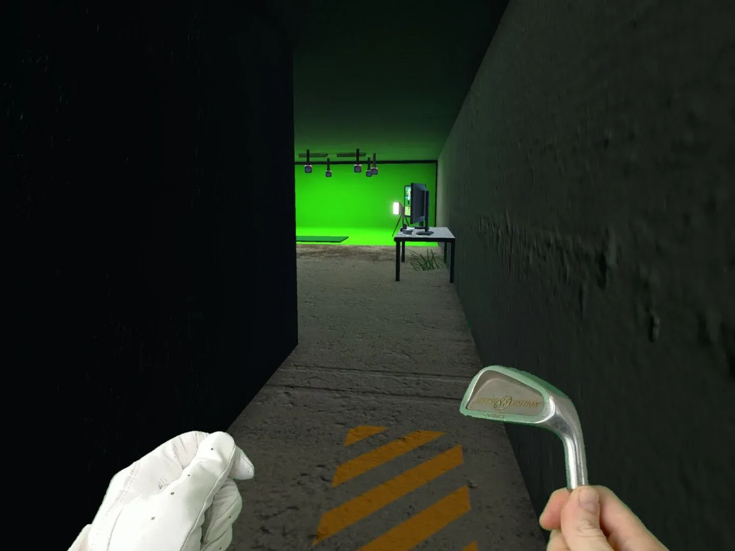 A golf ball on a quiet course with an unsettling path beyond it
