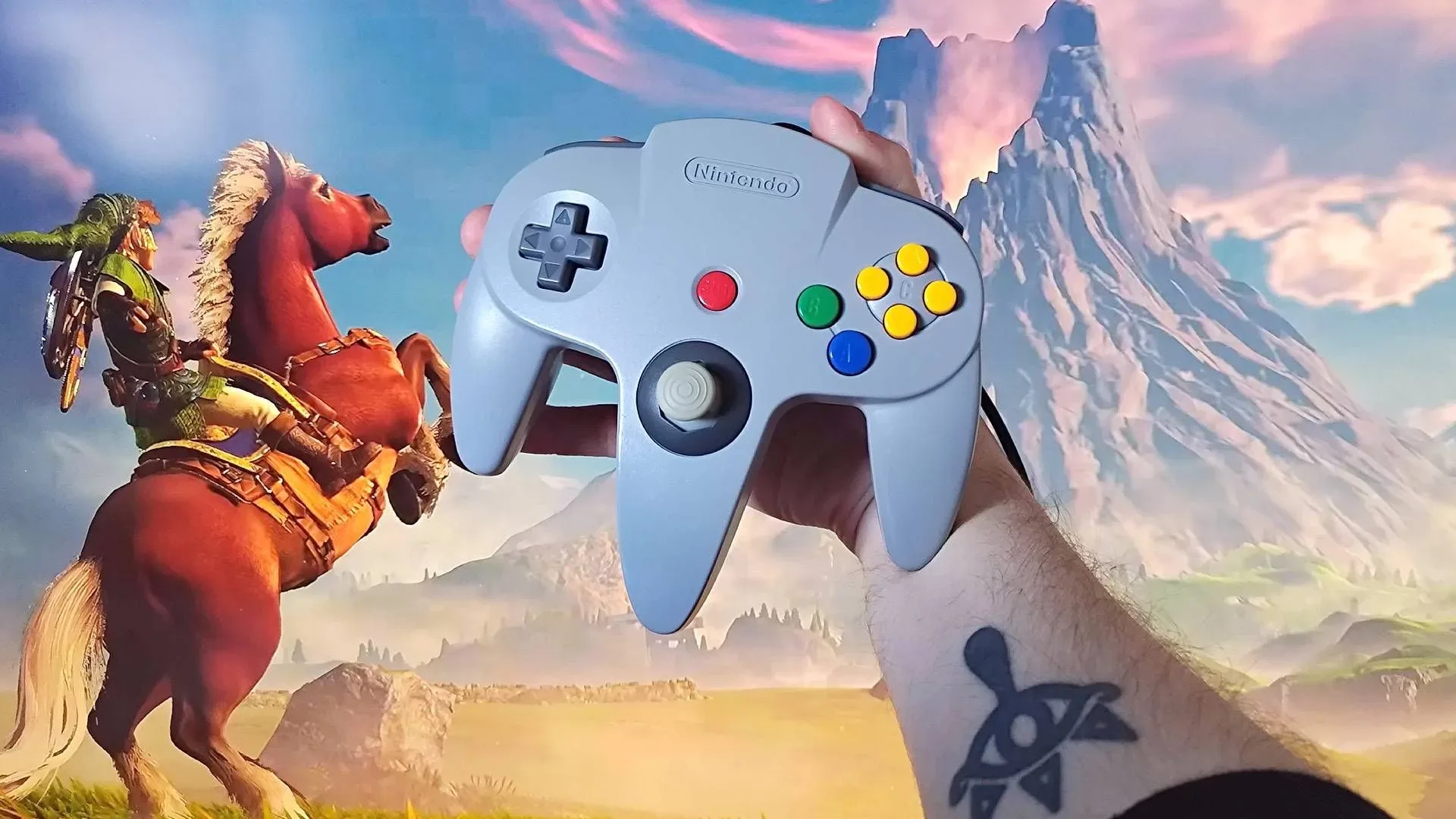 Nintendo 64 controller beside a modern Switch 2-compatible controller