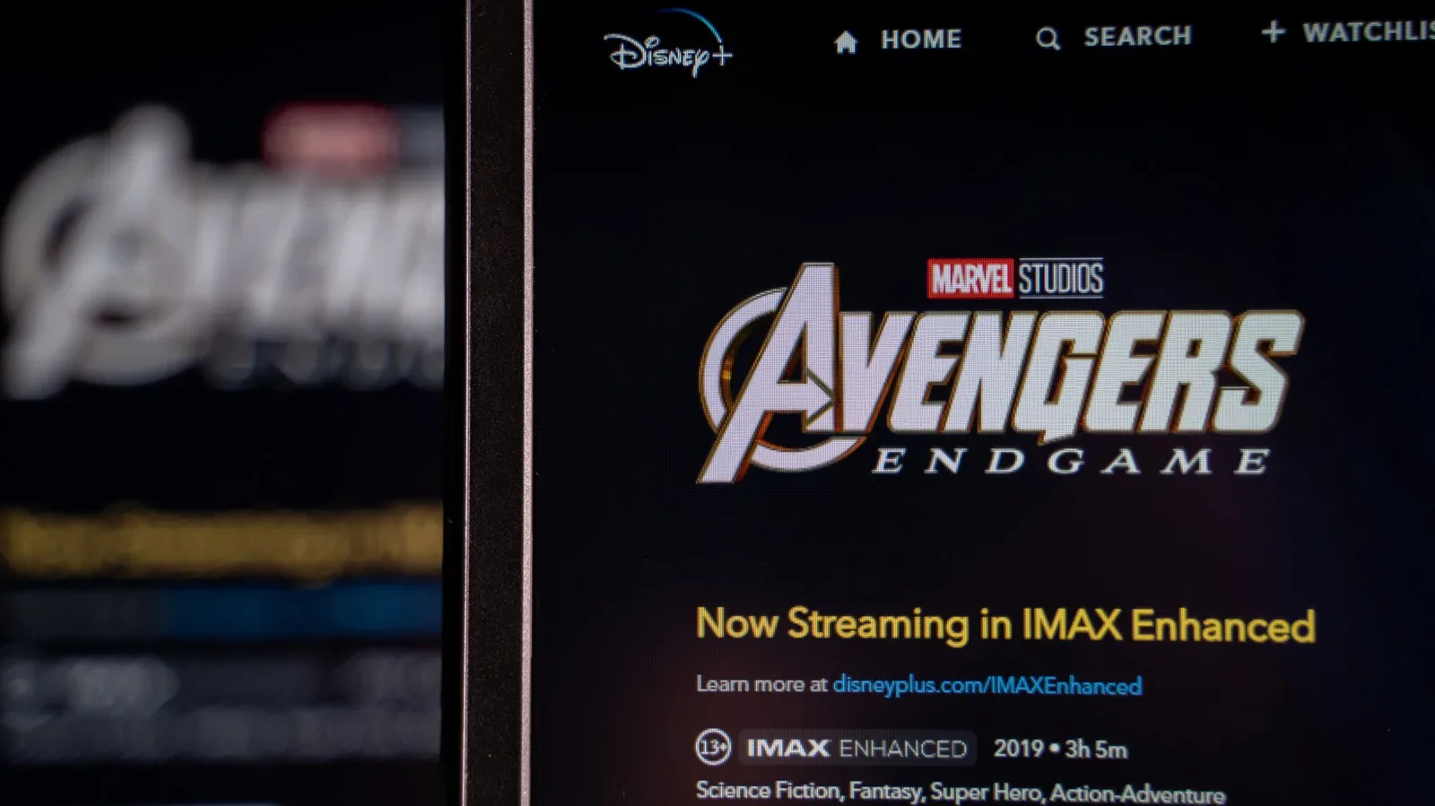 A 16:9 television showing a comparison between widescreen and taller IMAX Enhanced movie framing