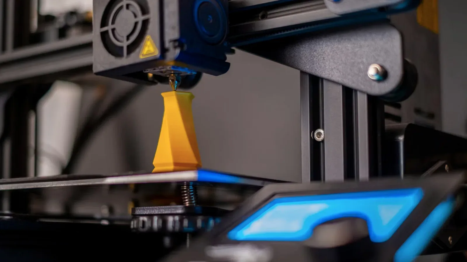 A desktop 3D printer producing tabletop gaming terrain