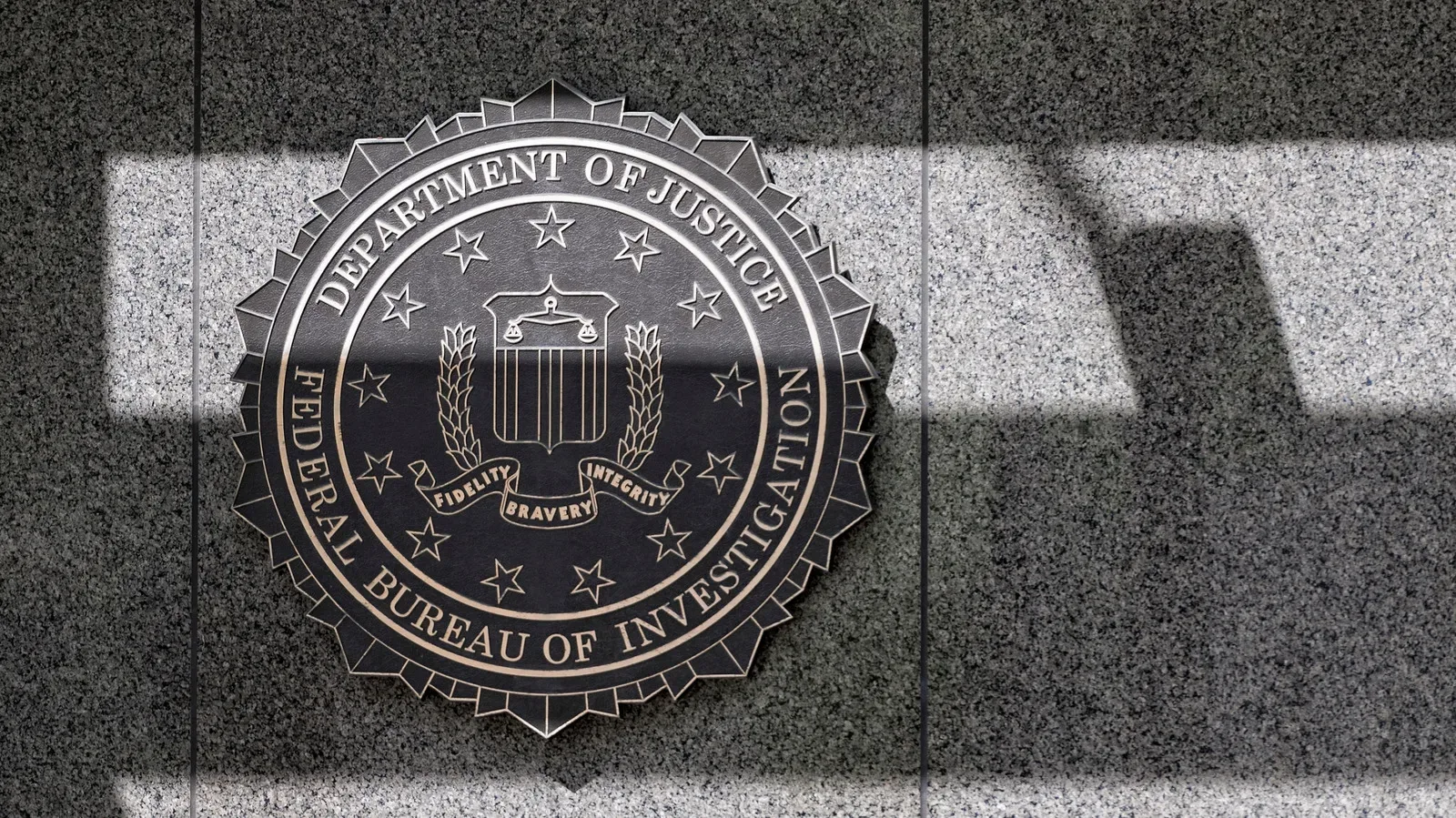 Illustration of a cybersecurity alert involving alleged FBI employee data exposure