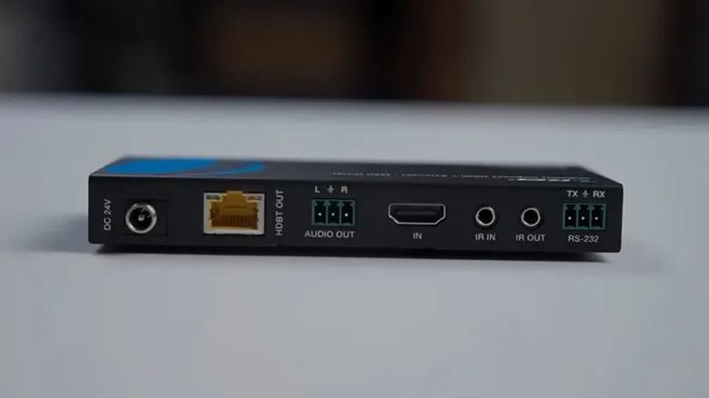 A black HDMI-to-Ethernet transmitter shows an HDMI and Ethernet inputs and outputs.