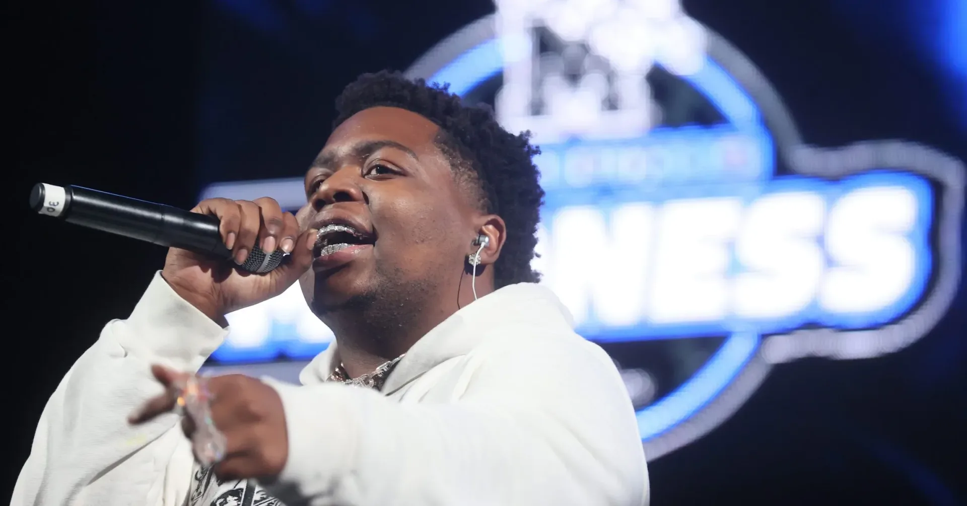 Big30 holding a chain identified as belonging to Pooh Shiesty in a social-media video