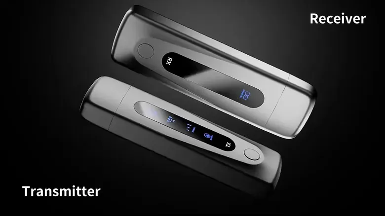 The receiver and transmitter ends of a grey wireless HDMI extender stand against a dark background.