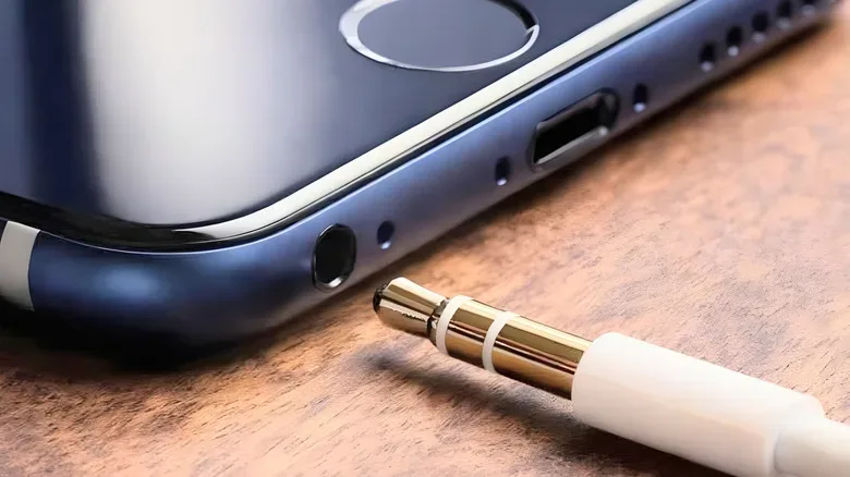 Close-up comparison of a 3.5mm headphone jack and USB-C port on mobile devices