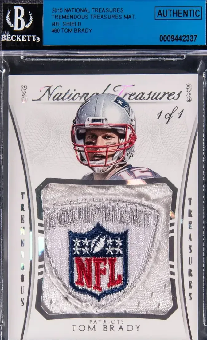 Tom Brady in silver Patriots helmet peaking over the top of NFL patch from his jersey.