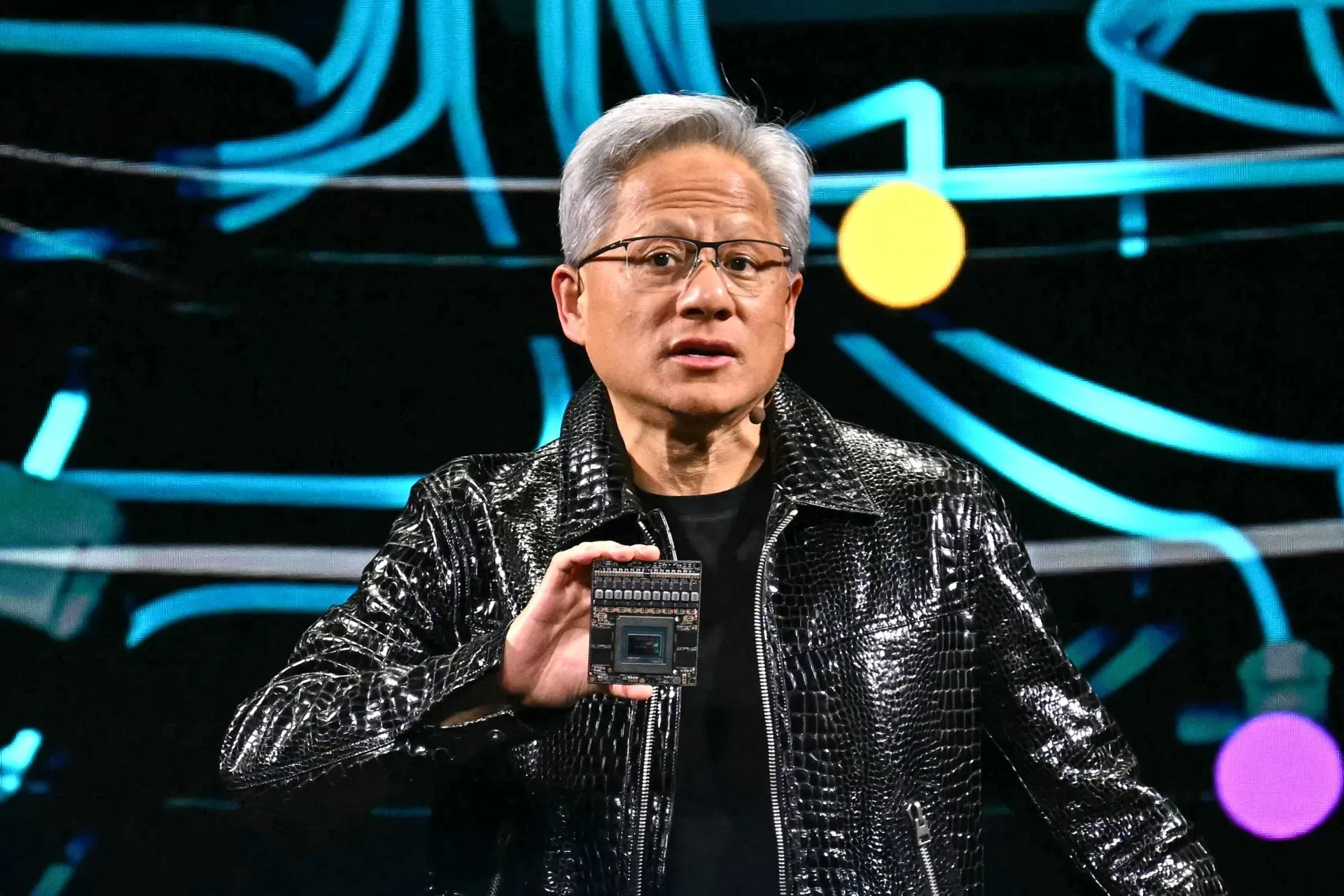 Jensen Huang speaks during an AI industry event