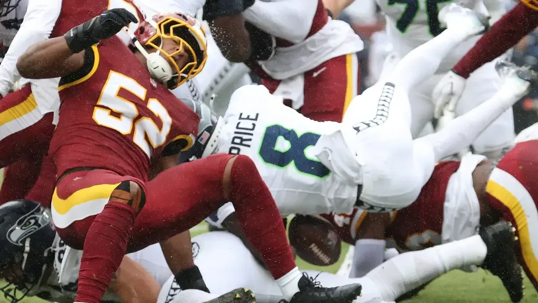 Washington Commanders linebacker Sonny Styles forces a fumble against Seattle Seahawks running back Jadarian Price