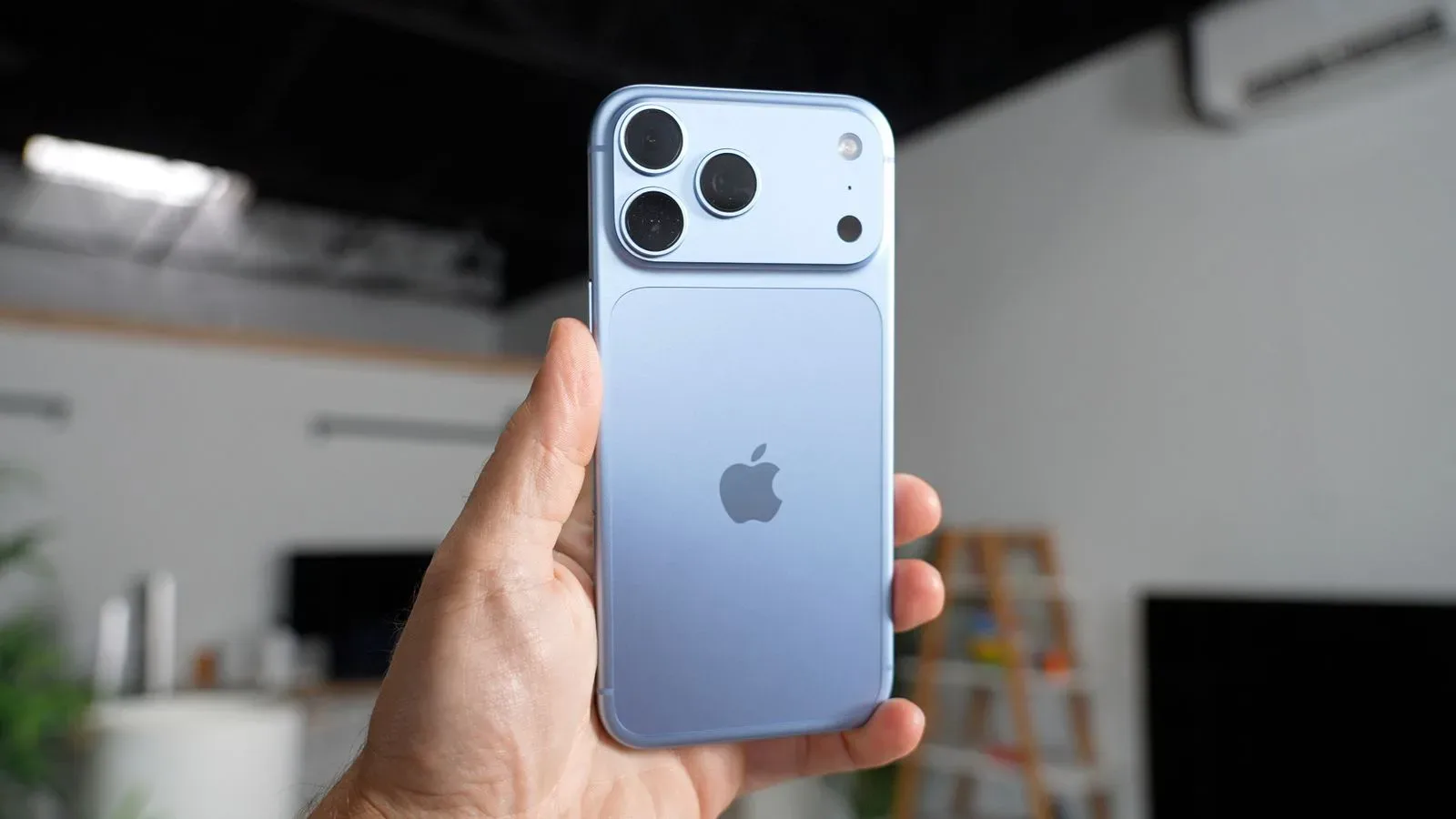 iPhone 18 Pro in glacier blue with matching glass back and aluminum frame