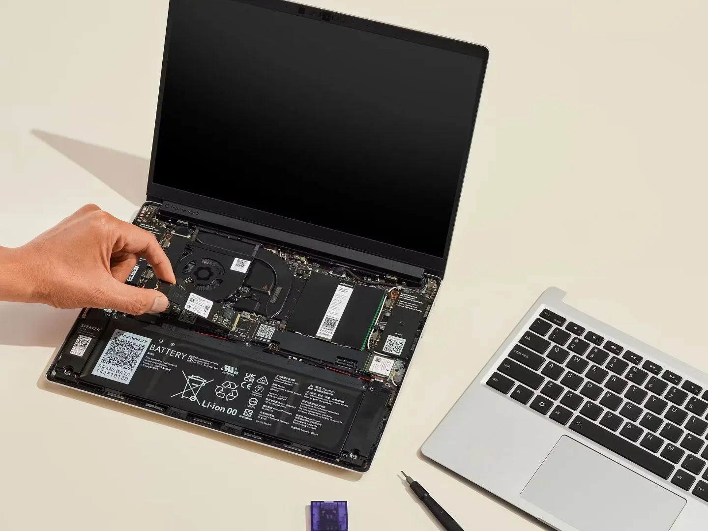 An image from Framework showing a laptop being assembled