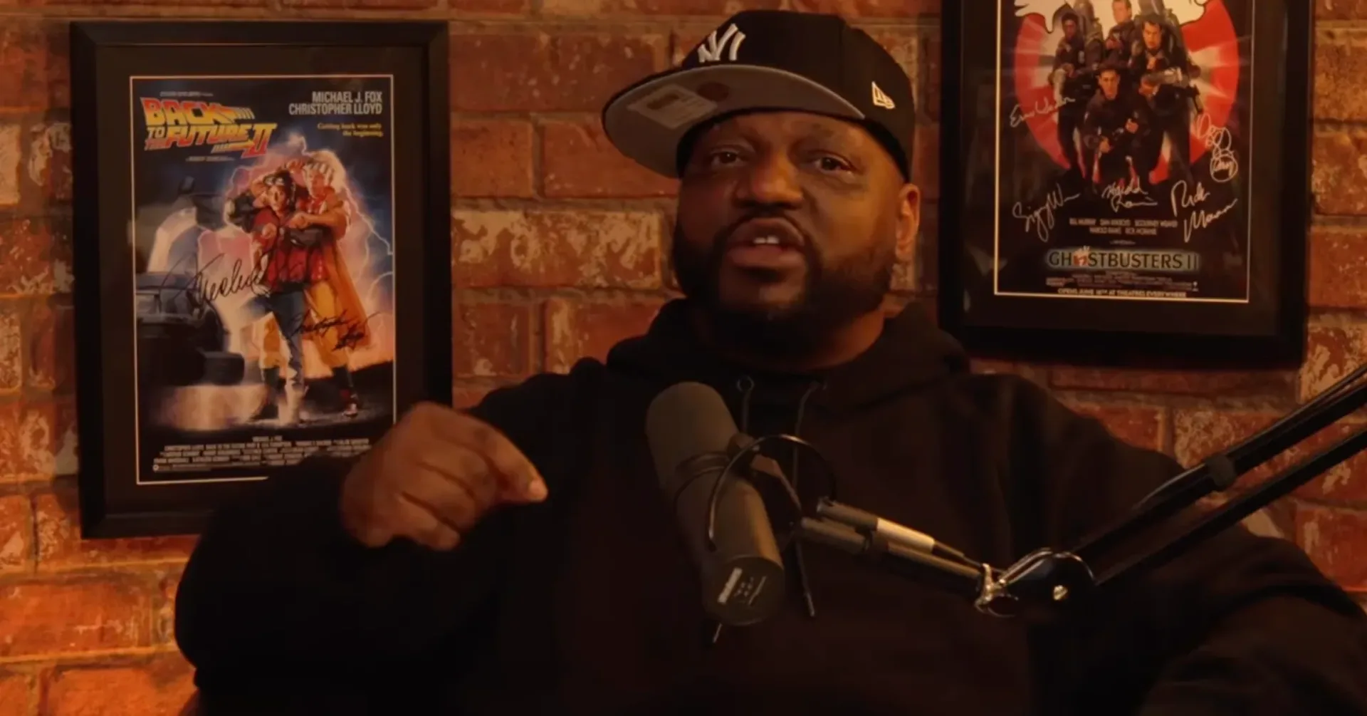 Aries Spears and DJ Vlad during a tense in-studio discussion