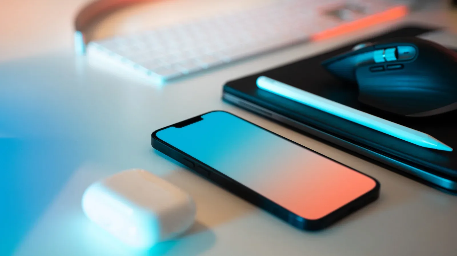 An iPhone and iPad shown side by side to illustrate their different sizes and pricing tiers