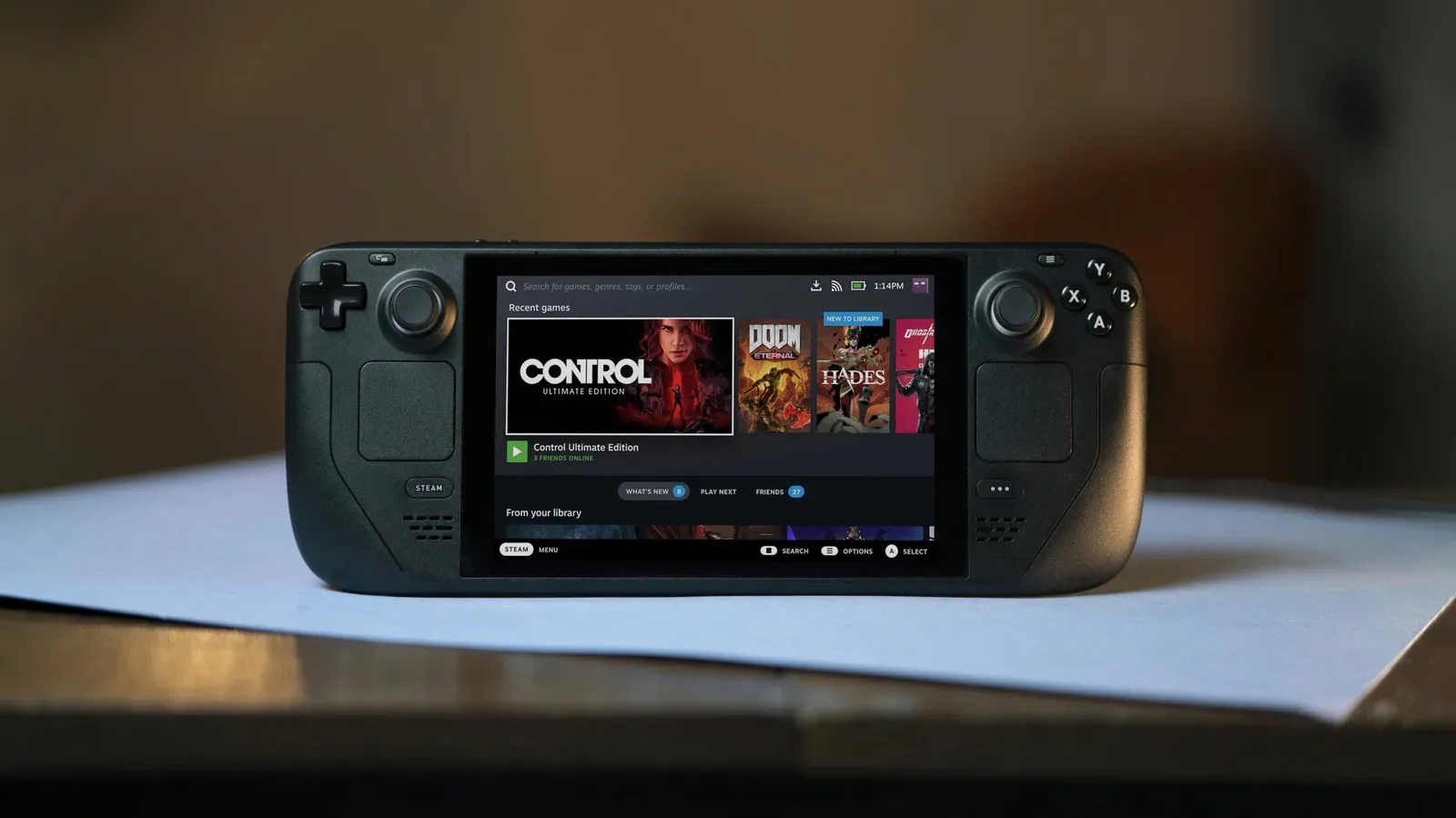 Steam Deck OLED handheld showing a Steam game library