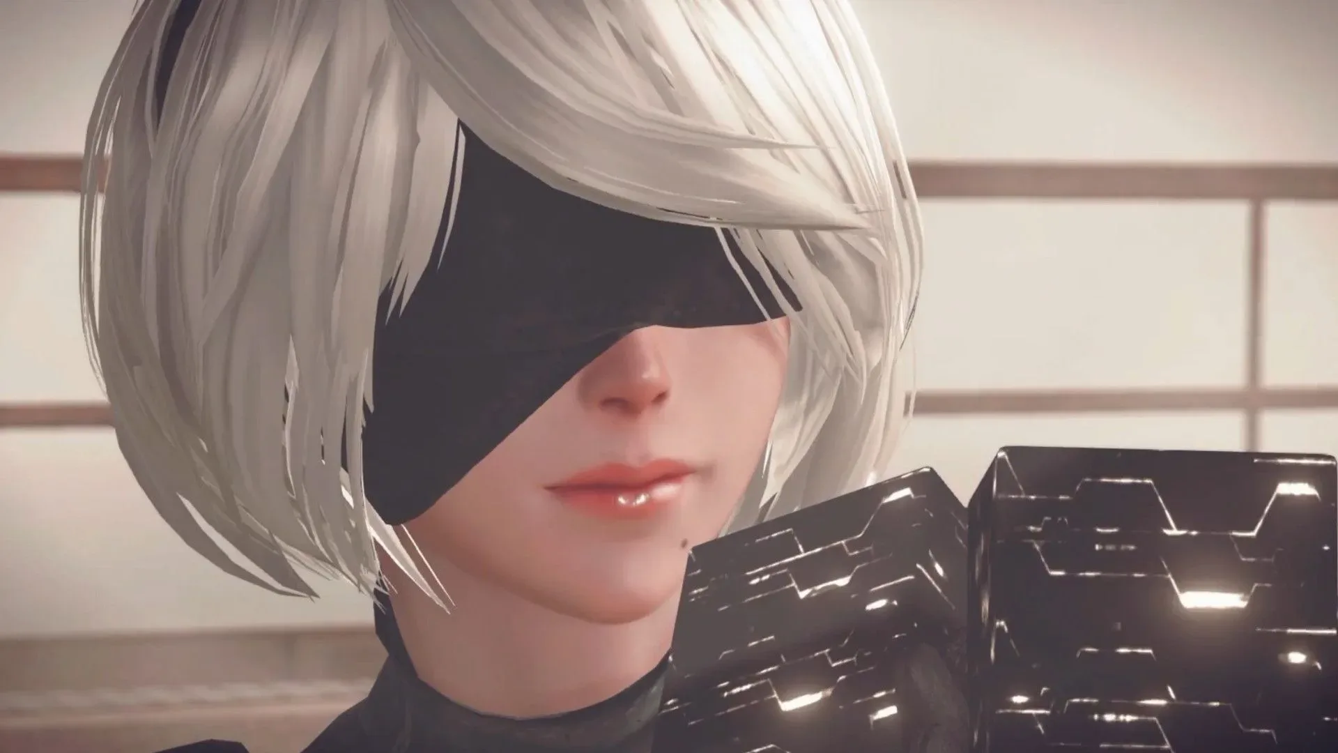 Yoko Taro wearing an Emil mask during a Nier: Automata discussion