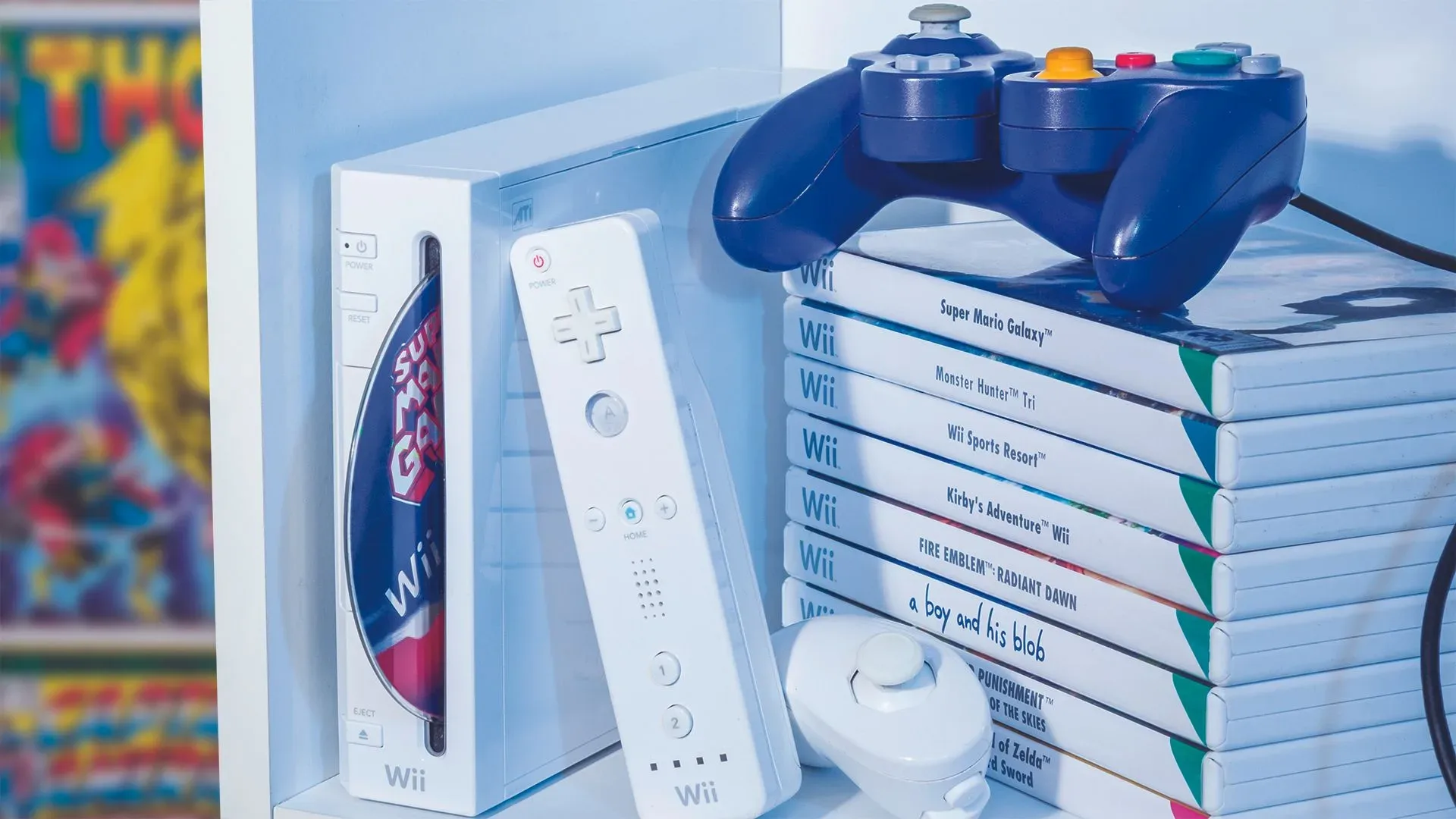 A Nintendo Wii and PlayStation 3 displayed as part of a retro gaming collection