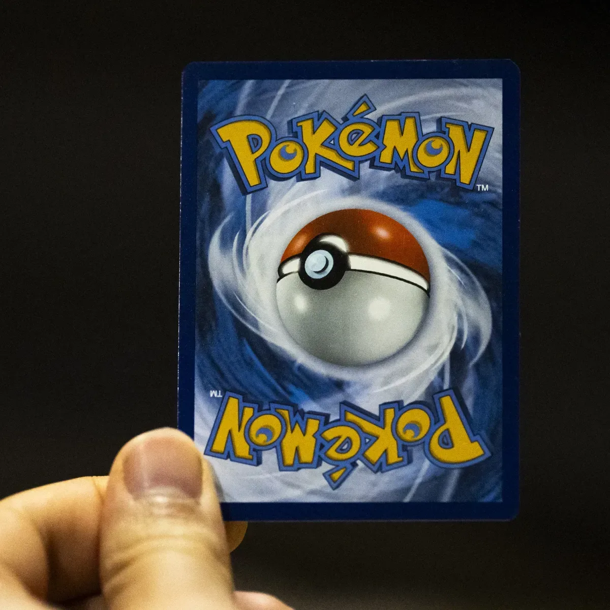 Graded Pokémon trading cards displayed in protective slabs