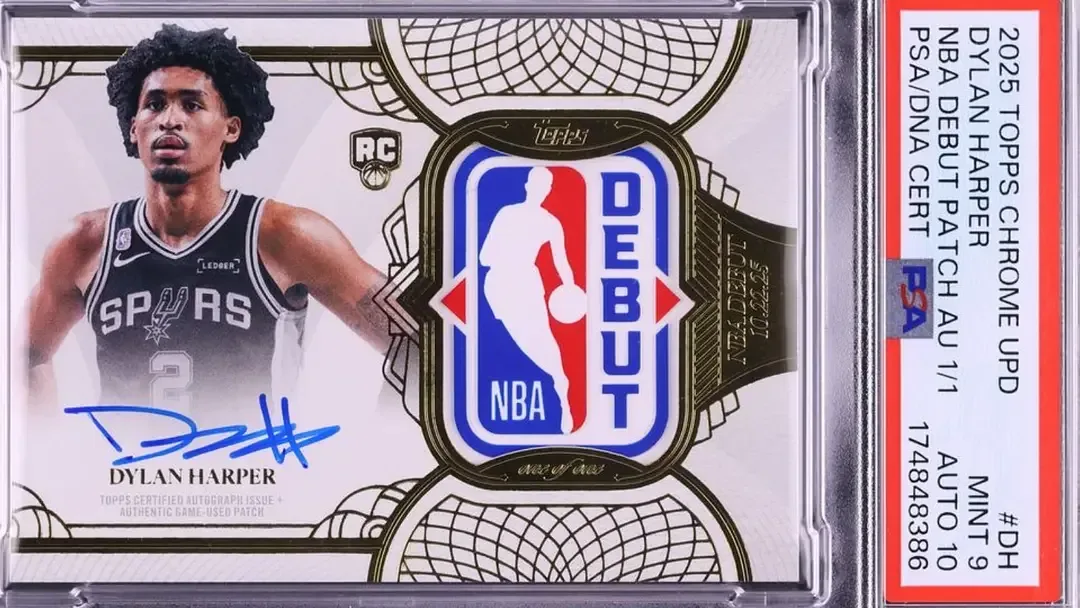 Image of player in Spurs Jersey with blue autograph below image and NBA debut patch on right side of card in PSA slab.