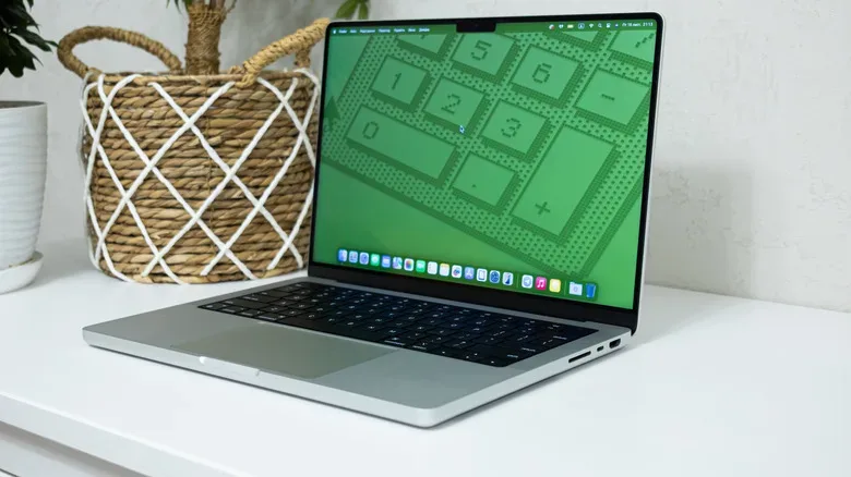 Refurbished MacBook Pro with ports and display being checked before purchase