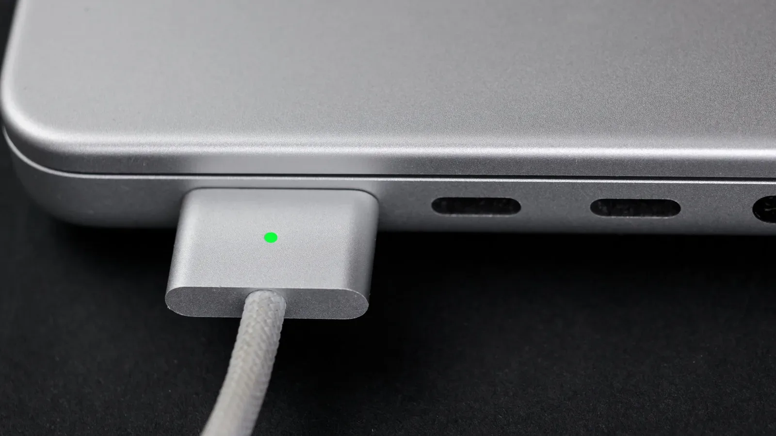 MacBook charging with a magnetic MagSafe 3 connector