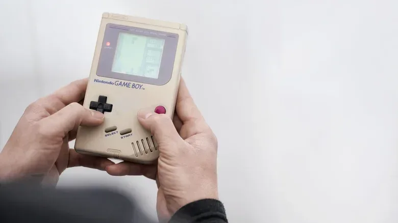 Close-up of a Game & Watch clamshell handheld and directional pad
