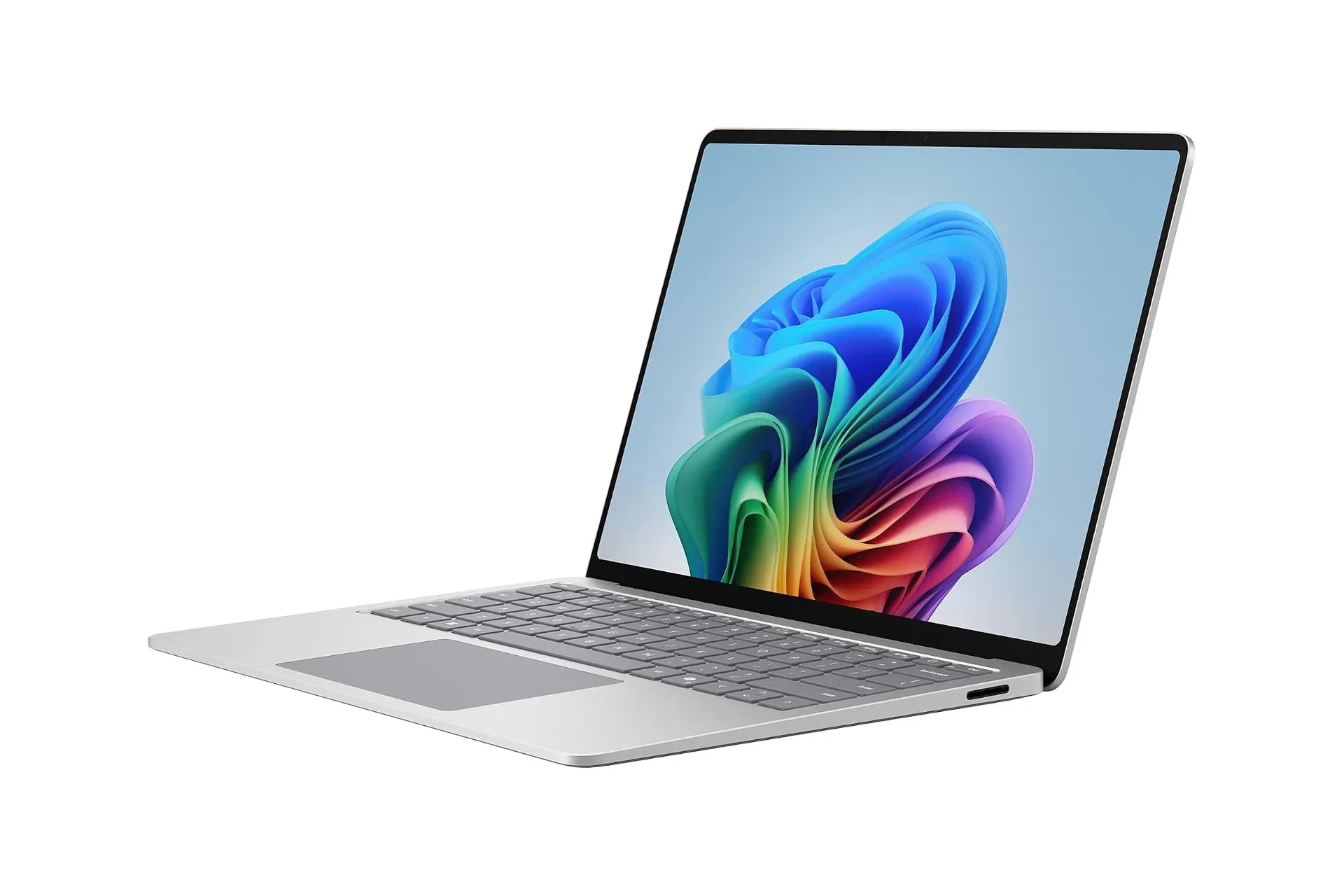 Microsoft Surface Laptop 2026 in platinum beside notebooks on a student desk