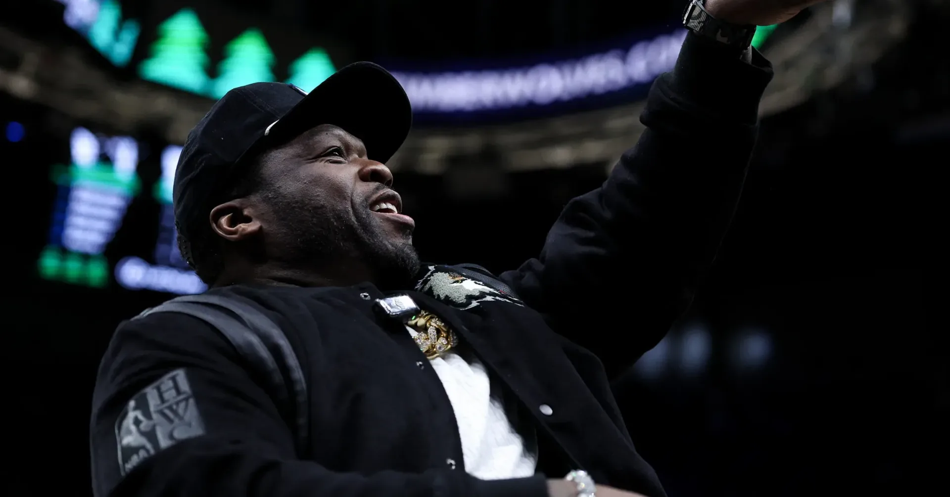 Tony Buzbee, Frances Buzbee and 50 Cent pose together at a Houston children’s charity event