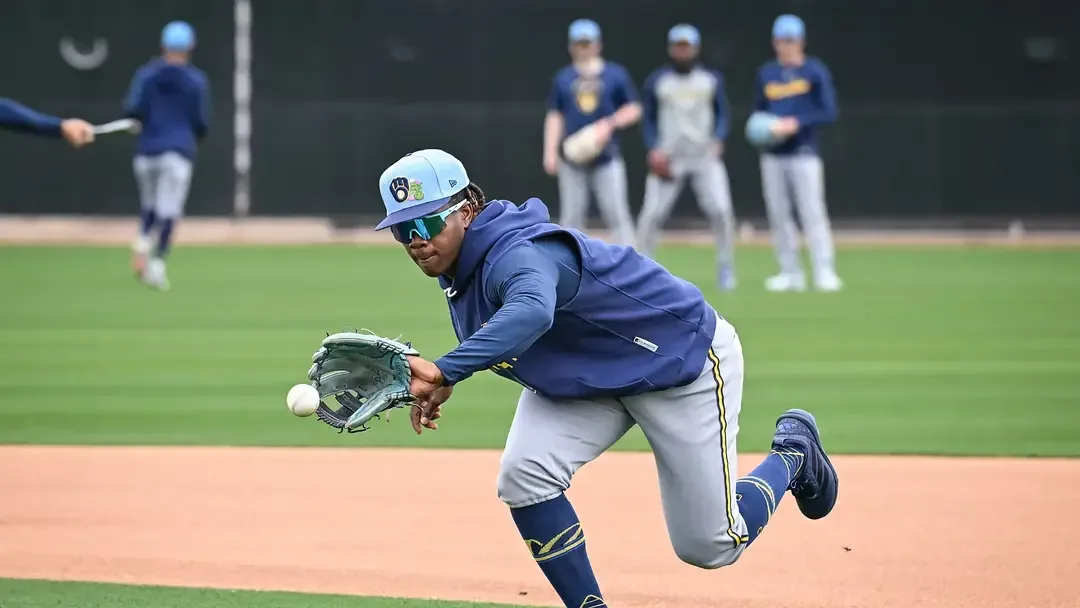 Milwaukee Brewers prospect Jesús Made fields a ground ball during 2026 spring training.