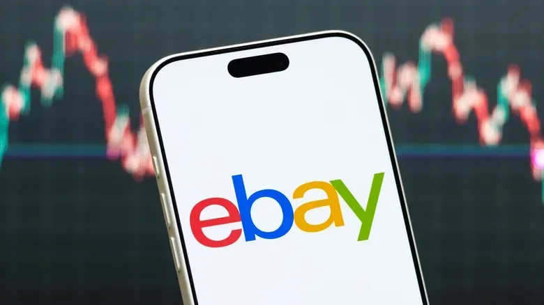 eBay opened on a phone over sales chart.