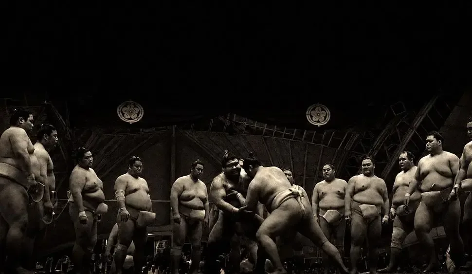 High-contrast portrait of a sumo wrestler preparing for competition