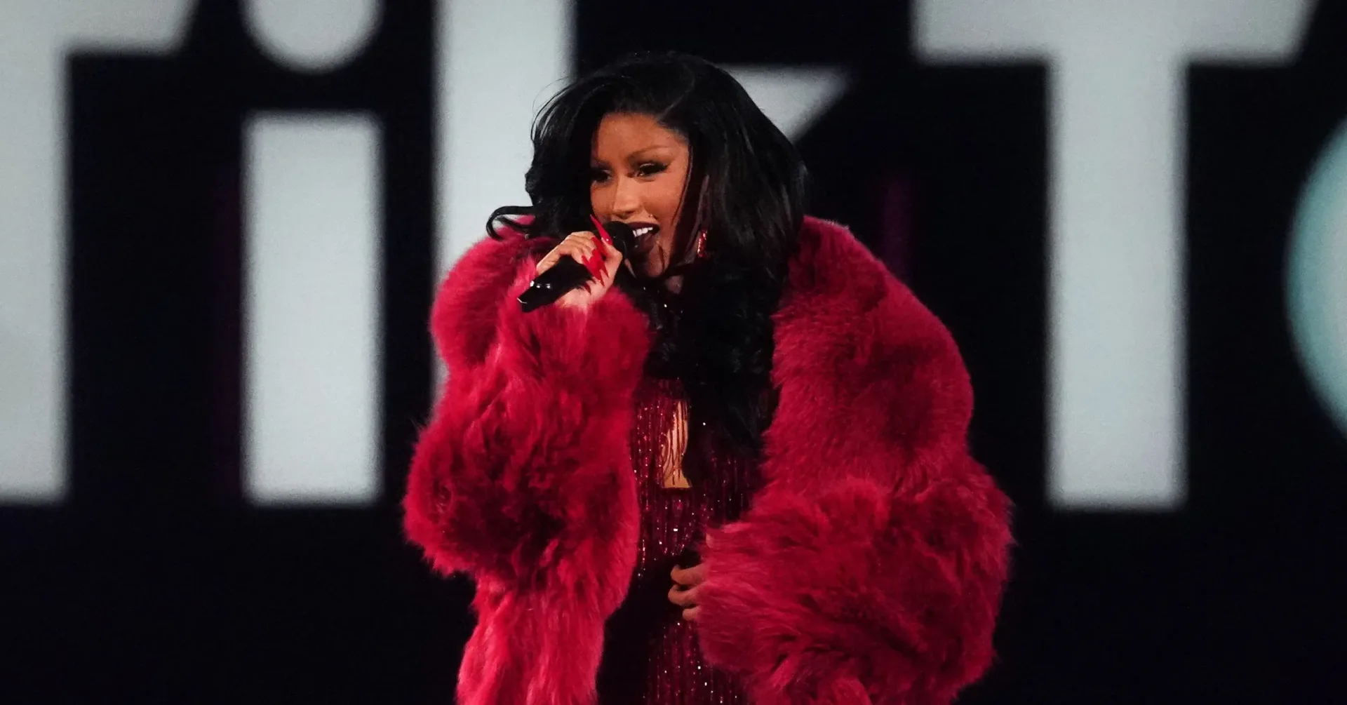 Cardi B discussing Grow-Good Beauty and her family legacy at a business event