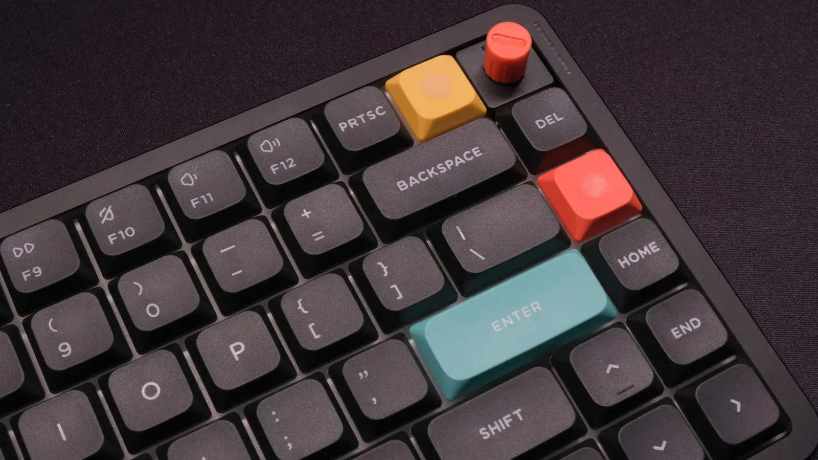 A wired mechanical keyboard connected to a gaming PC