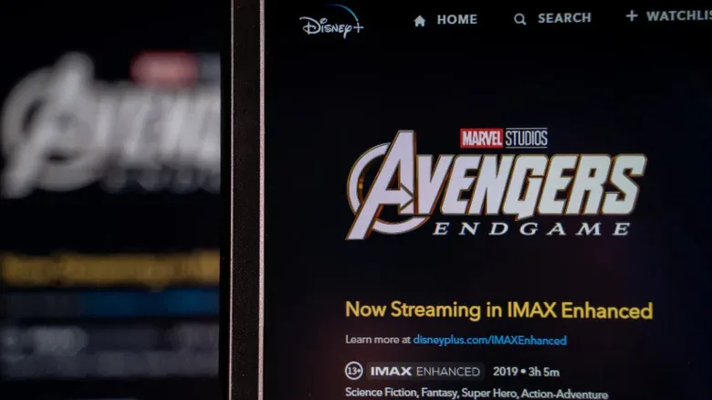 A home theater television displaying a movie with narrow black bars in a 1.90:1 aspect ratio