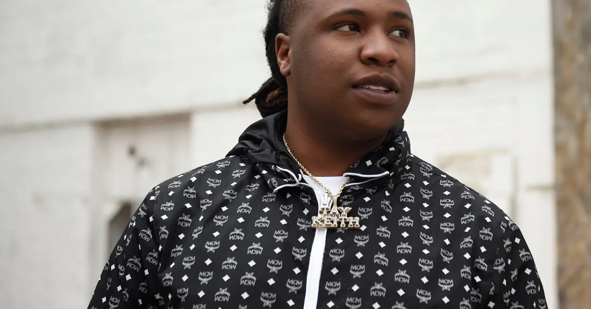 A respectful memorial-style image representing the reported loss of producer Tay Keith