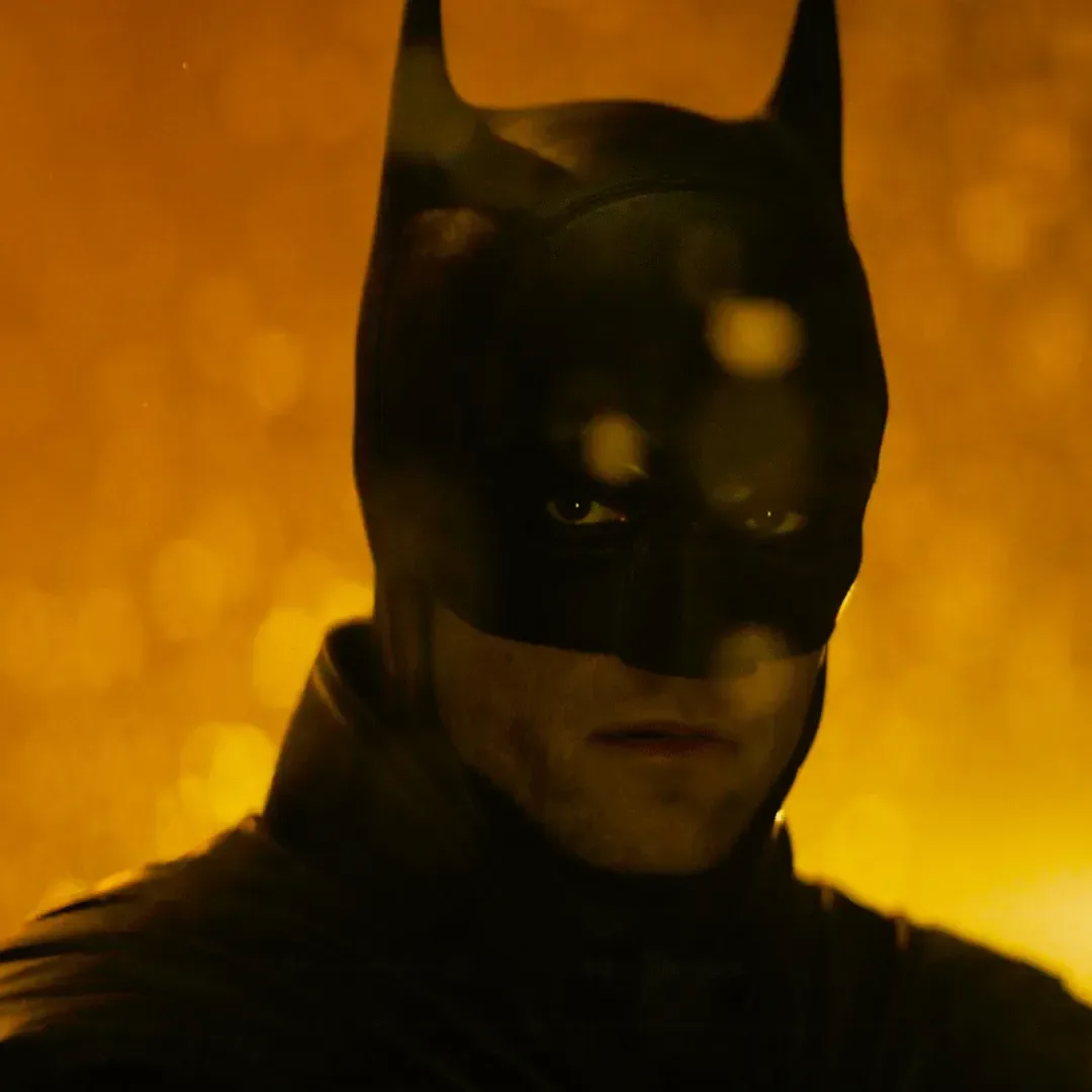 A silhouetted figure believed to be Bruce Wayne stands in a dark, snowy setting from The Batman Part 2 production.