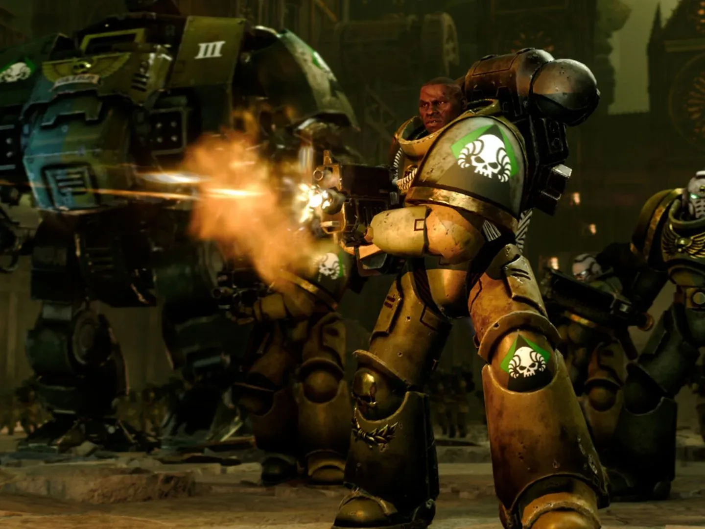 A space marine in green armor firing his rifle forwards as another space marine and a dreadnought approach from behind