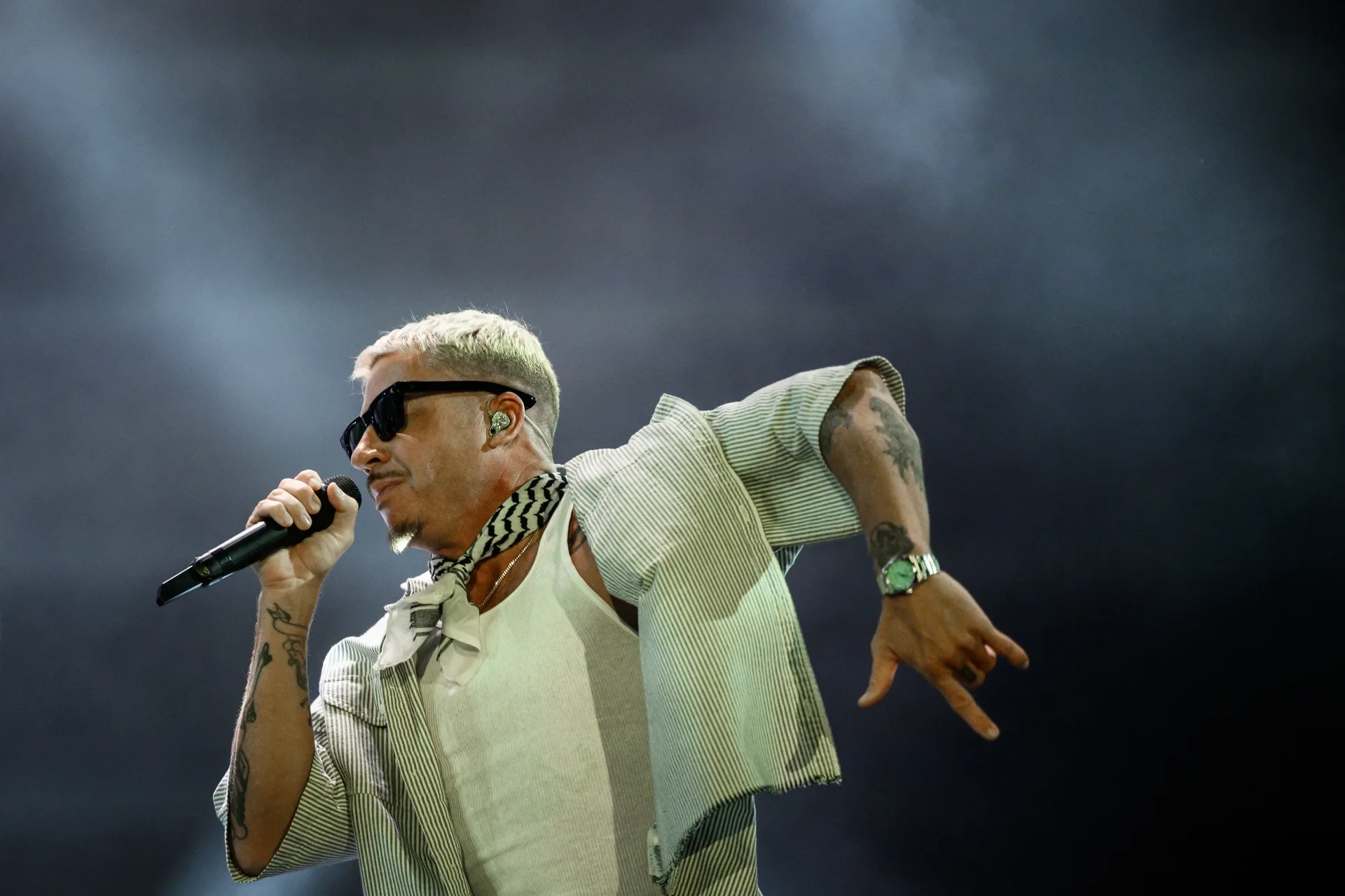 Macklemore performing during an arena concert opening set