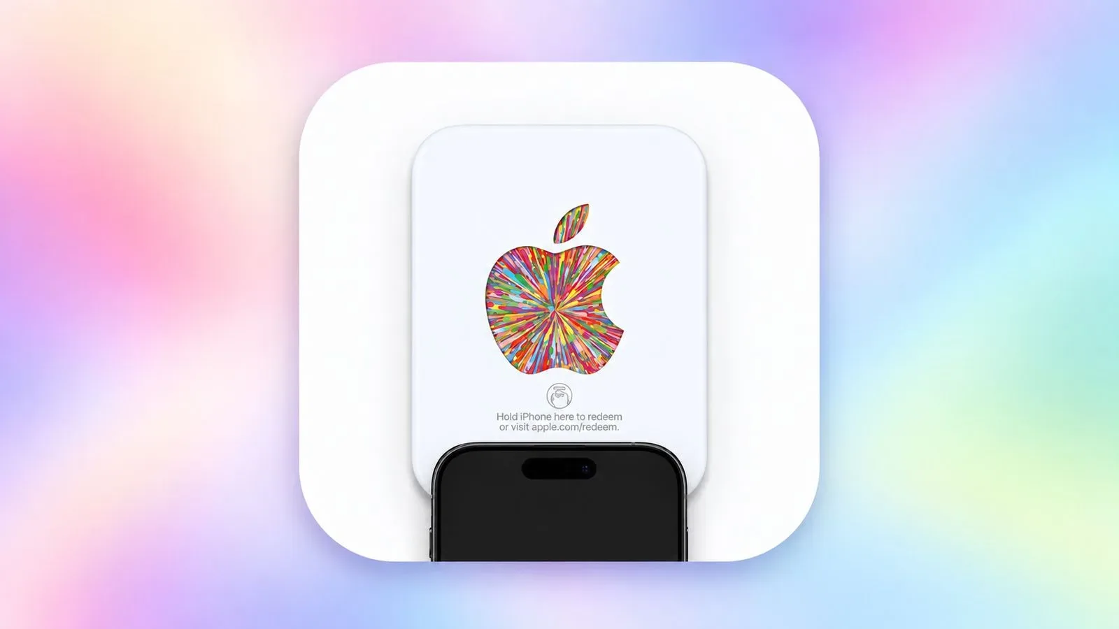 An iPhone held near the bottom of a new Apple Gift Card to begin NFC redemption