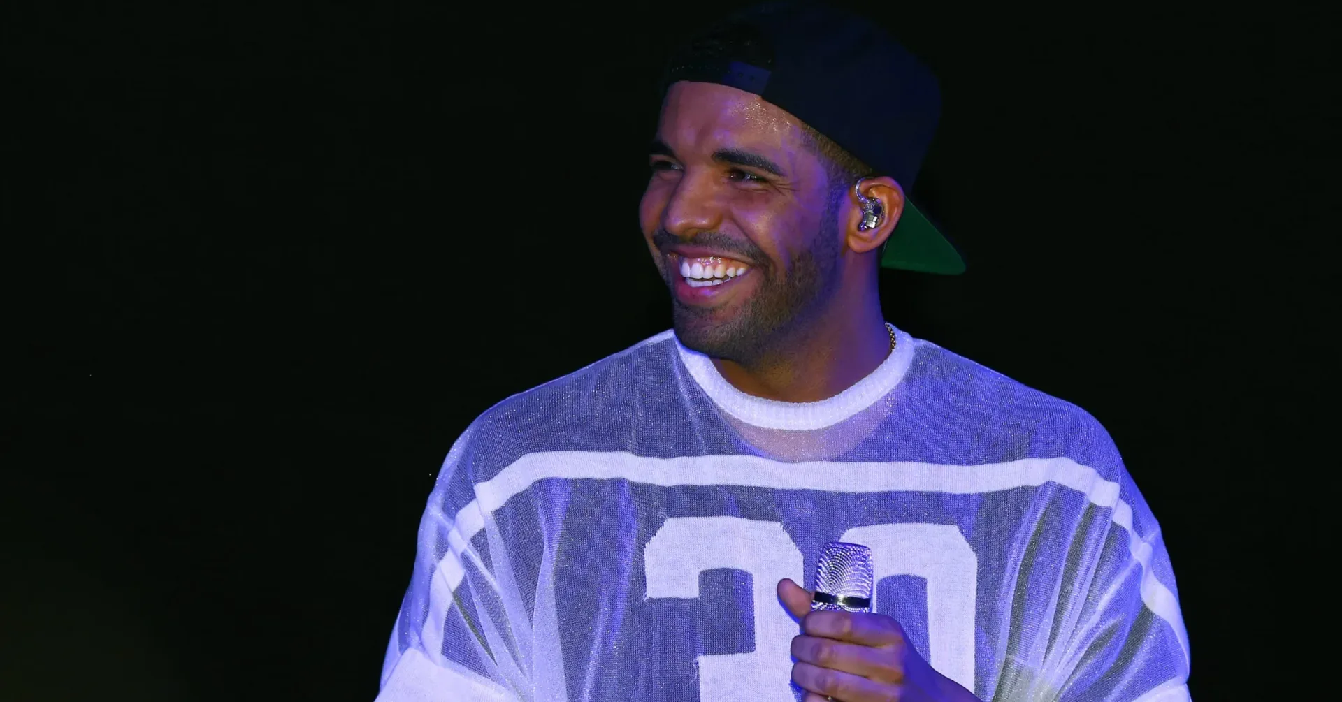 Yeat wearing a diamond-covered OVO owl chain with multiple chain strands