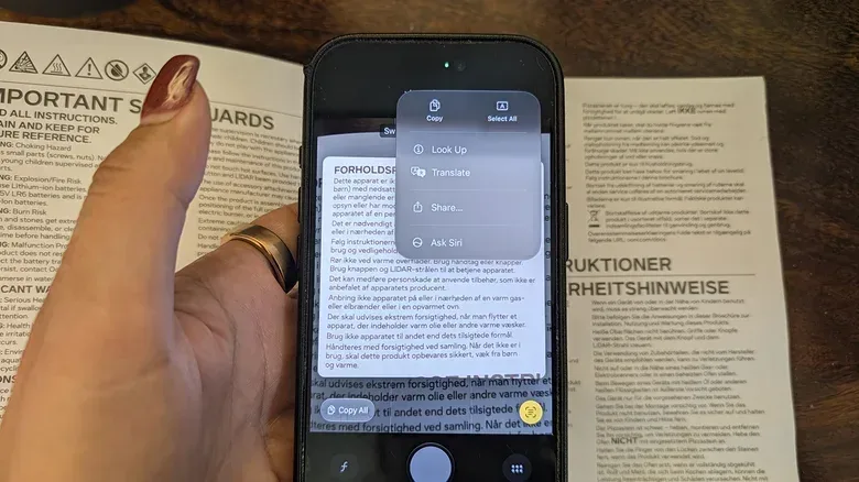 A comparison view illustrating iPhone Live Text for writing and Visual Intelligence for objects