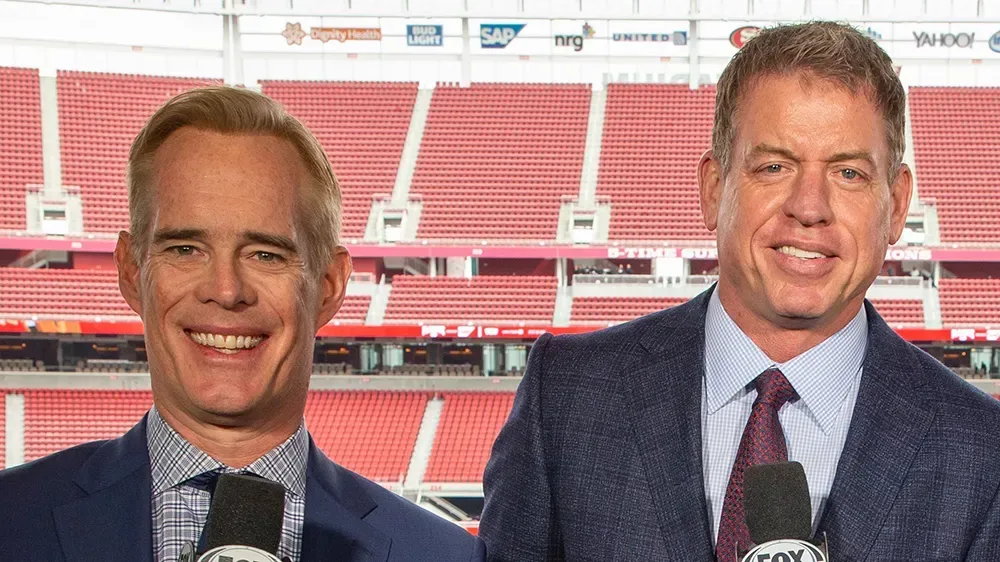 Joe Buck and Troy Aikman calling an NFL game from the broadcast booth