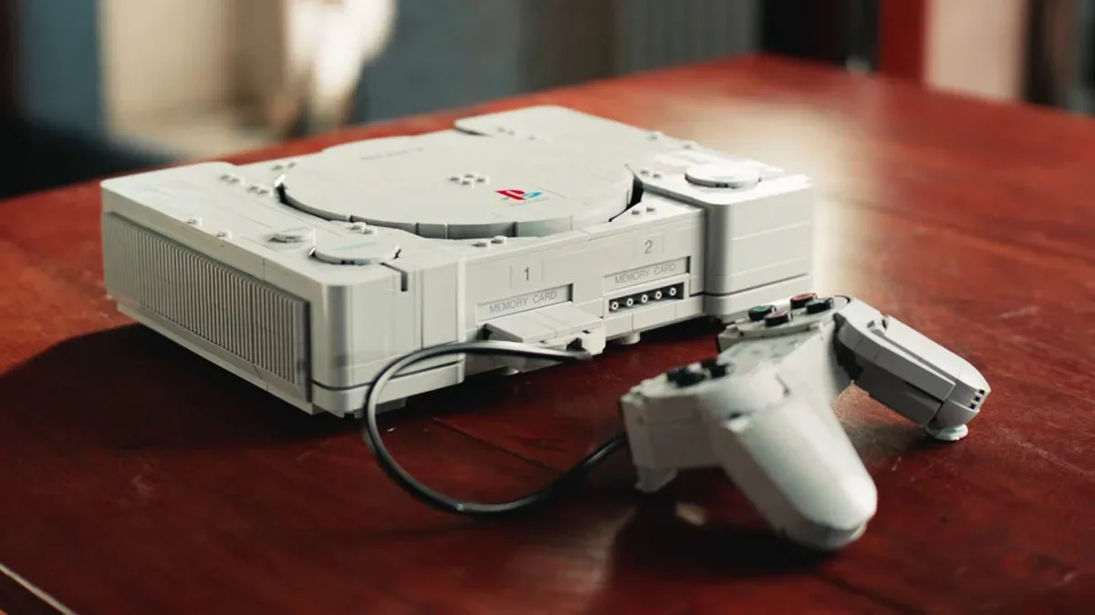 Lego replica of the original PlayStation console with its top disc lid open