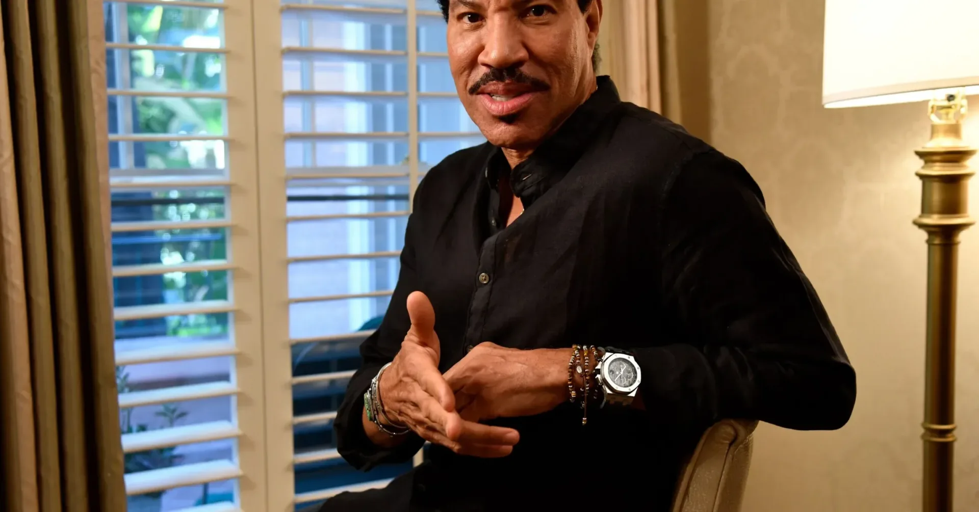 Lionel Richie performing onstage during a concert