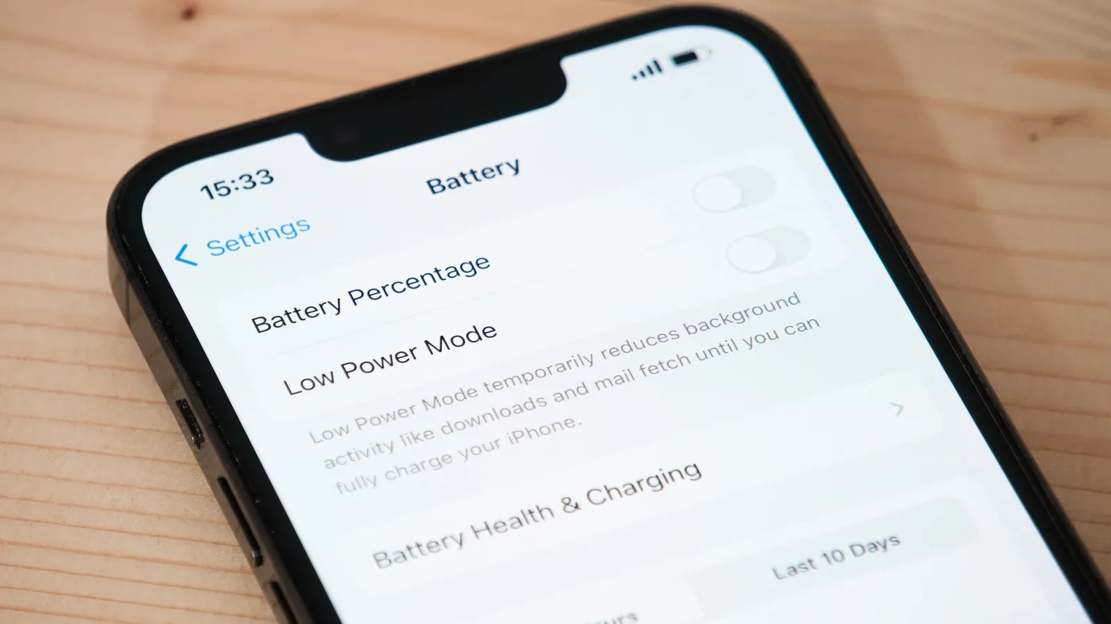An iPhone Battery Health screen showing maximum capacity and battery status