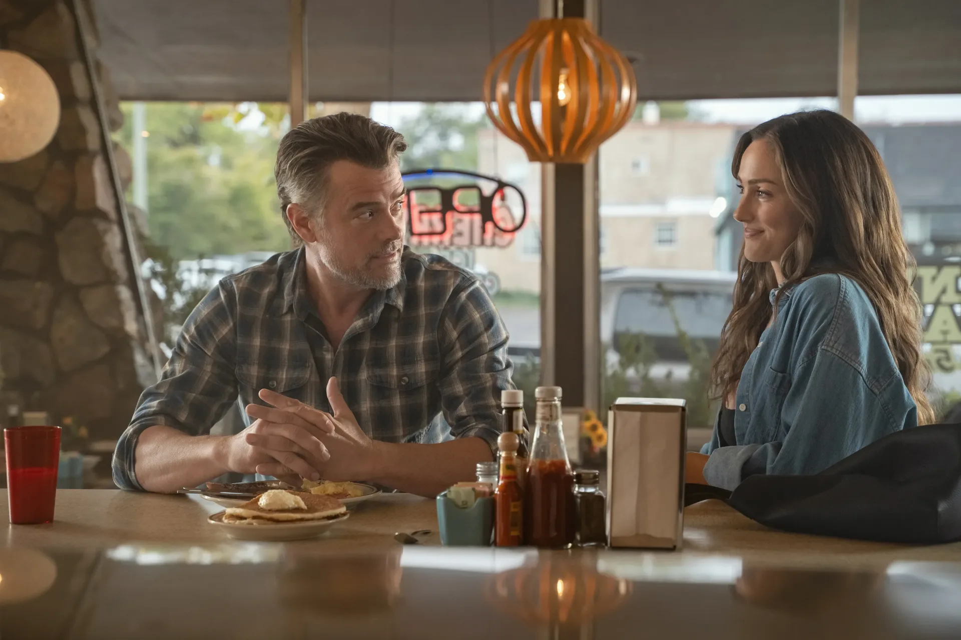 Josh Duhamel and Minka Kelly in Ransom Canyon promotional artwork