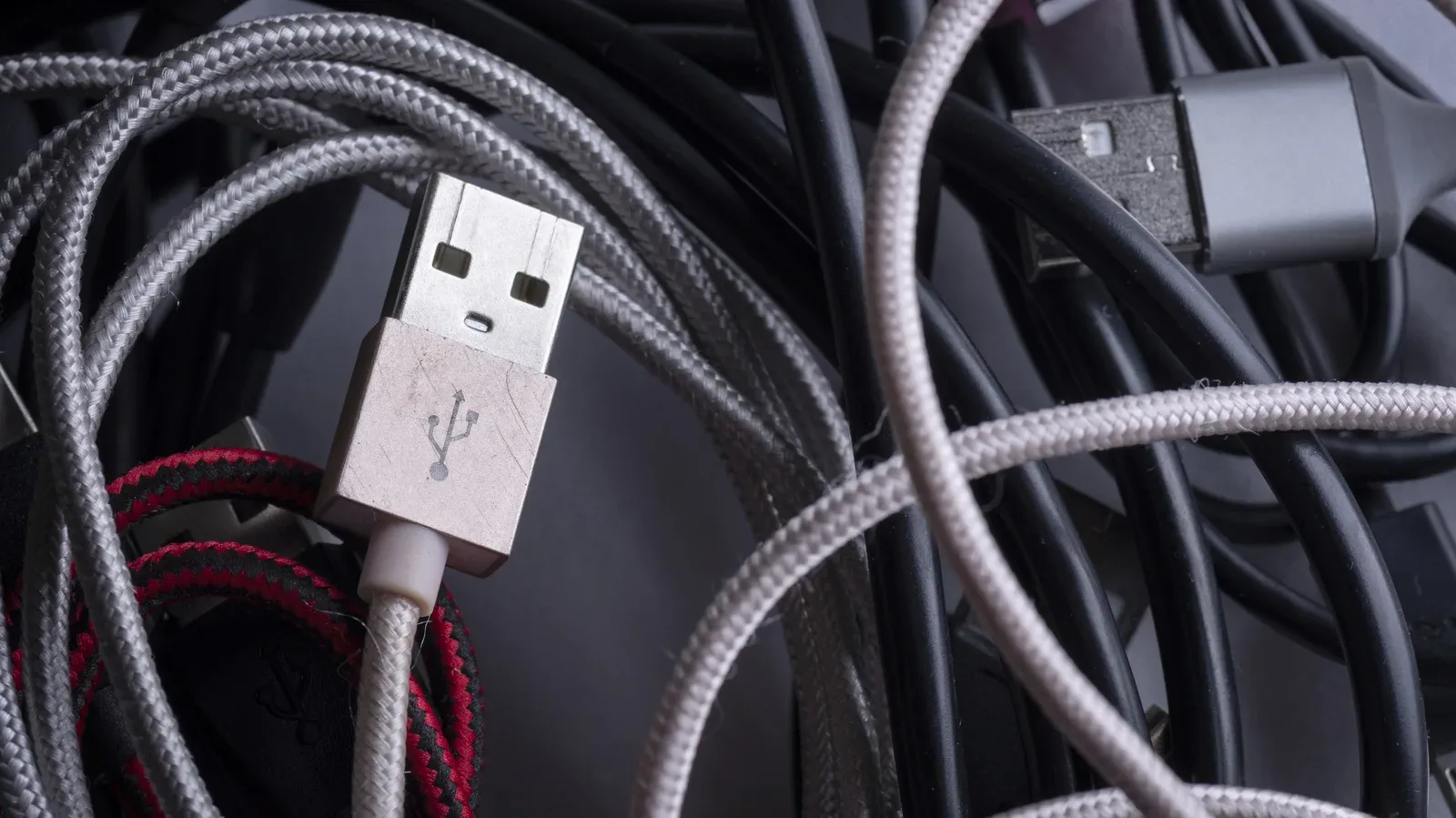A USB extension cable connecting gaming peripherals at a PC desk