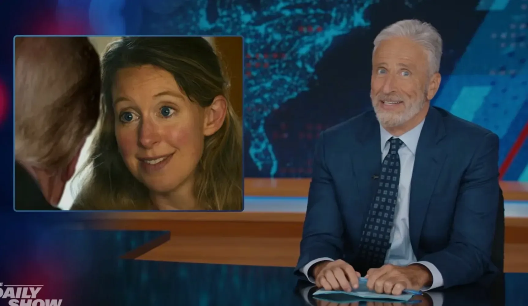 Jon Stewart at The Daily Show desk during a political comedy monologue